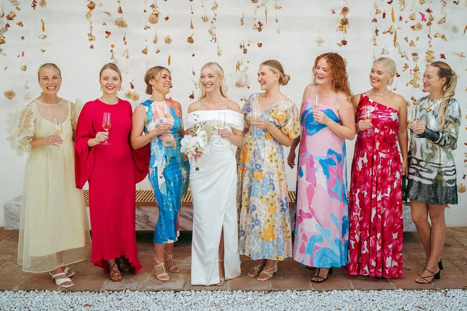 The bridesmaids in bright dresses