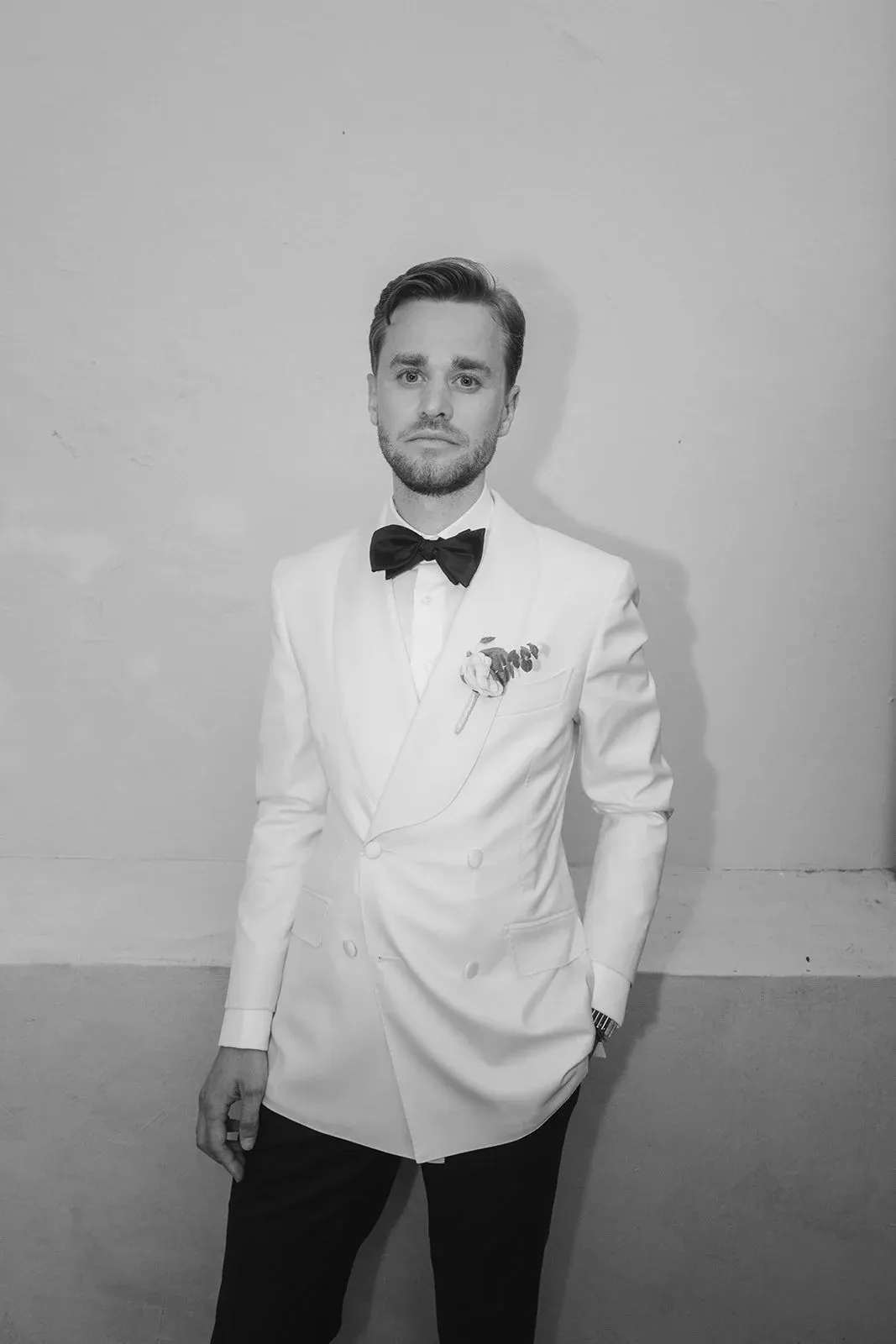 Lukas in a white dinner jacket, in black and white