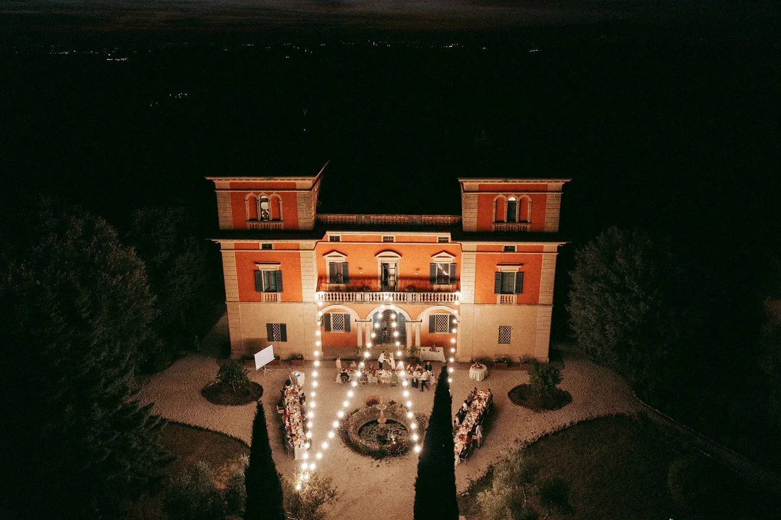 Villa Lena at night, lit from inside
