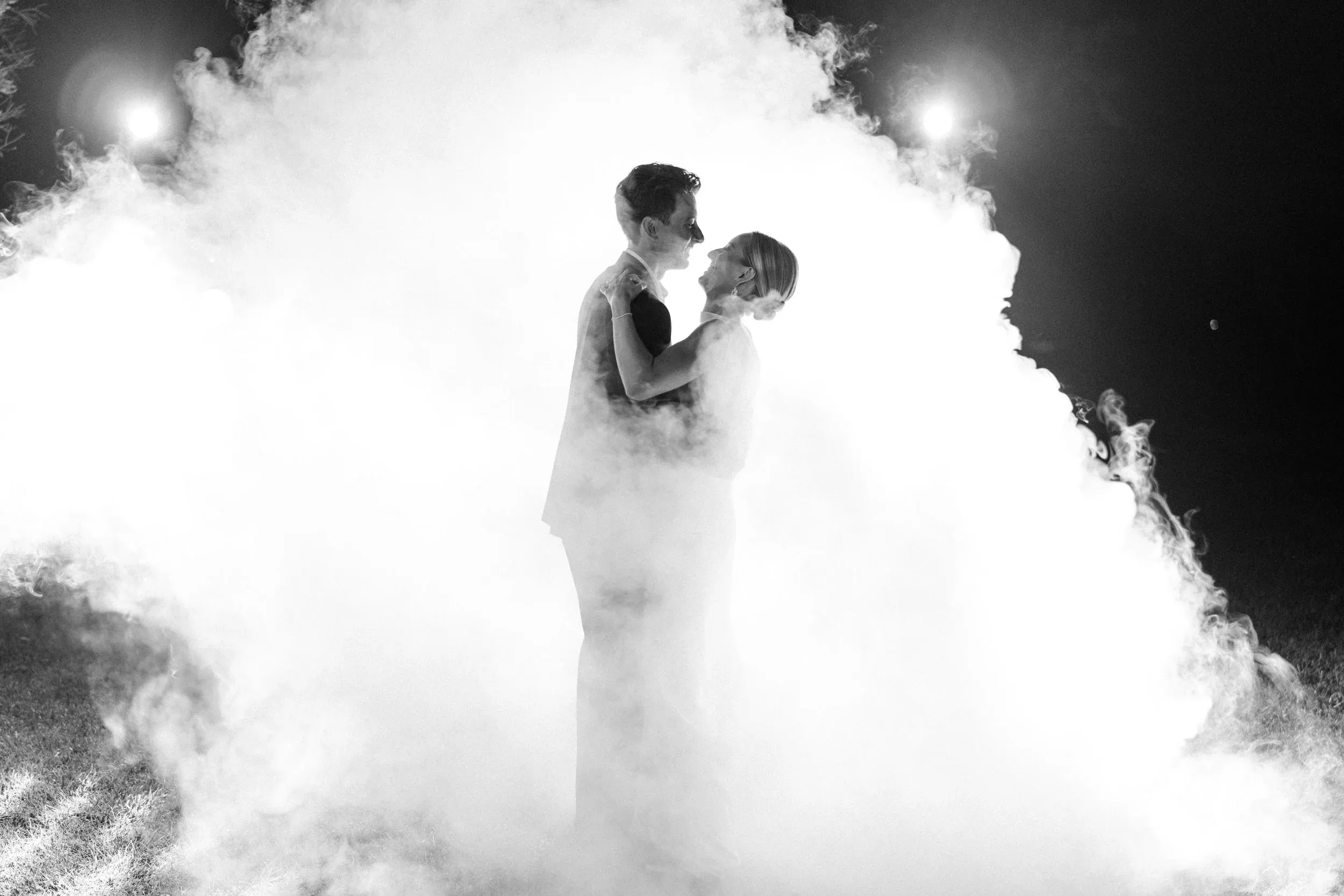A kiss inside a cloud of white smoke