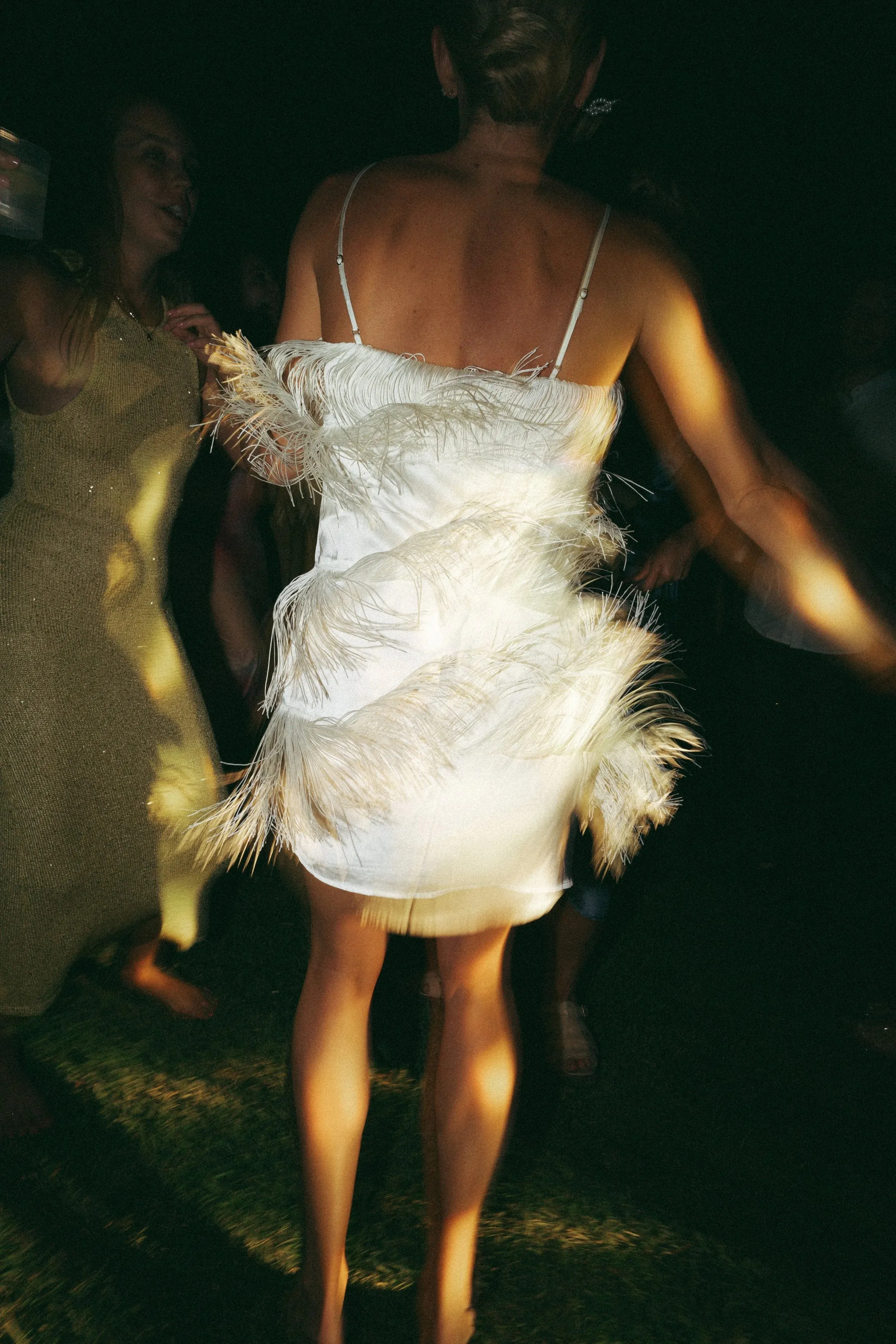 A fringed dress mid-dance